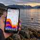 SonarKule floating in the fjord while the phone shows depth, bottom and fish